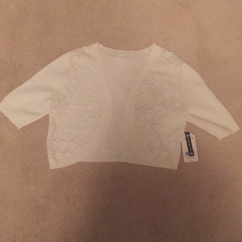 A girls white half sweater.